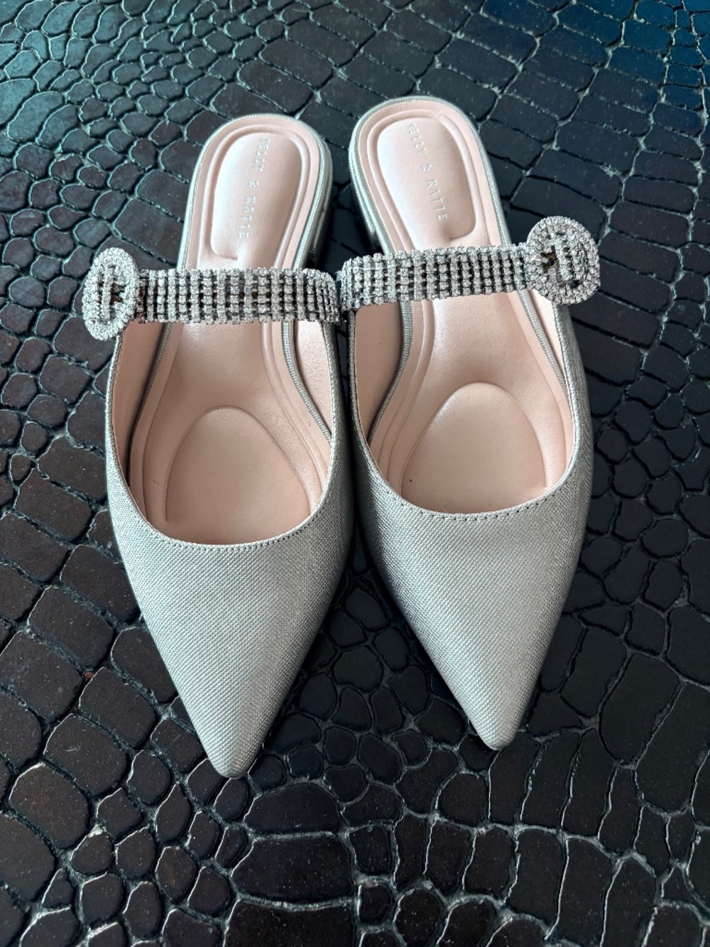 Kelly and Katie silver mules with crystal embellished strap,